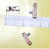 Перекл. движковый 6 PIN SK23D06G5 ON-ON-ON 0.3A 50V DC 3 положен. (15х4,3х4,5мм.) толкатель PG (h=4х2х2мм) вертик. монтаж, корп. метал. №65